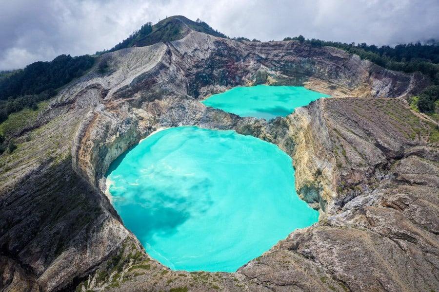 Aerial of the Kelimutu crater rim and its changing lake colours