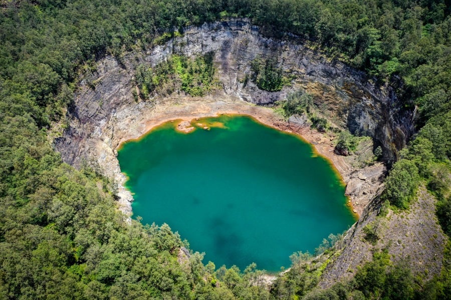Volcanic landscape of Kelimutu with the lakes cradled in the caldera
