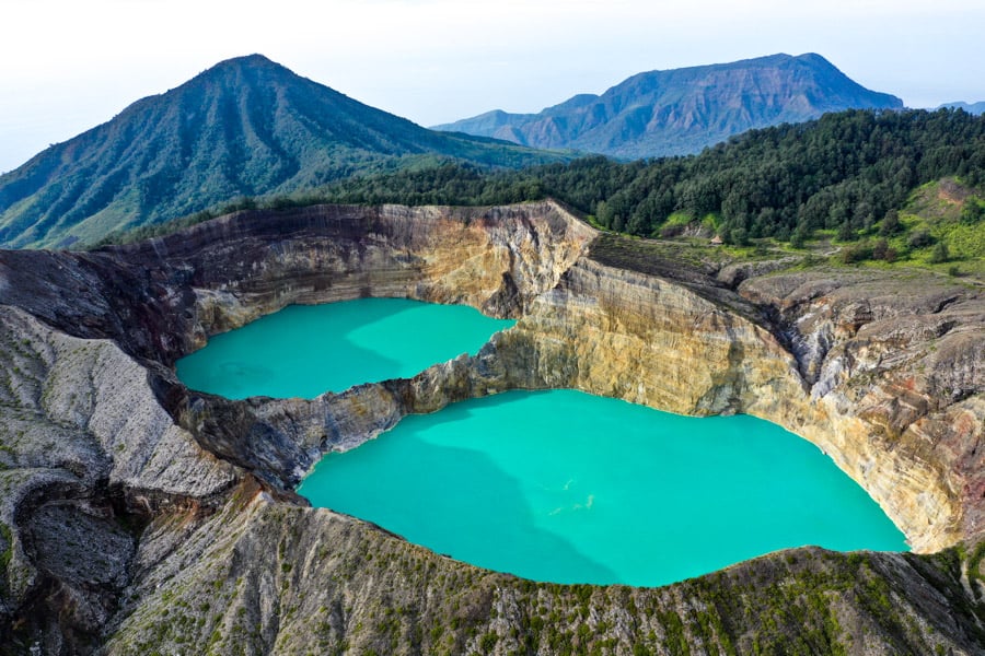 Wide view of the Kelimutu caldera lakes stretching into the distance