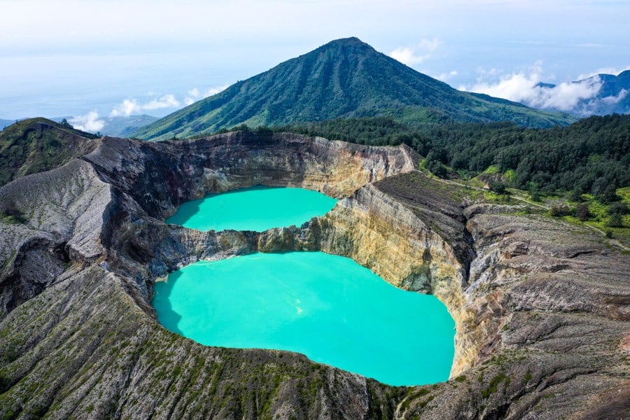 The Kelimutu lakes cradled by forested valley ridges