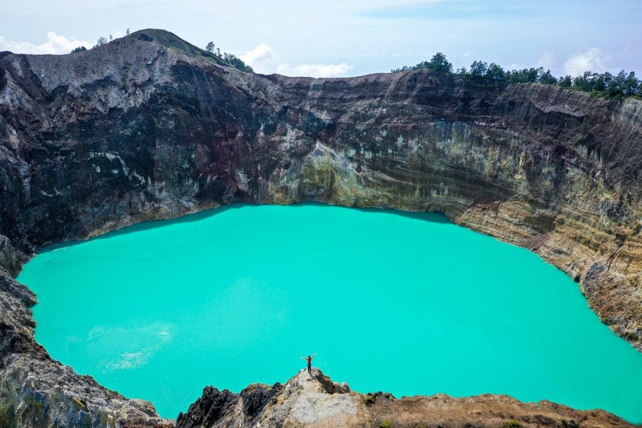 Sunlit aerial view of the Kelimutu lakes and ridge