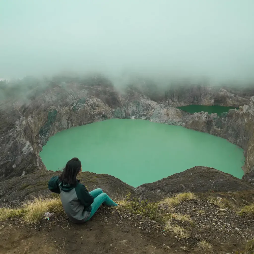 The colourful crater lake of Kelimutu glowing under morning light